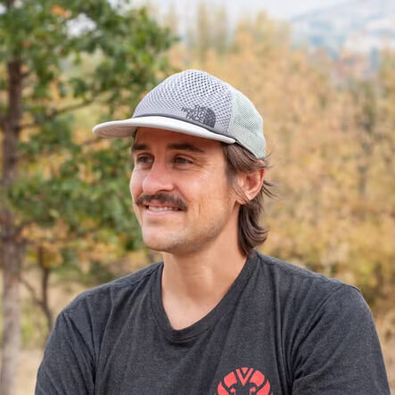 A man wearing a trucker hat